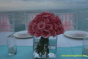 pink rose centerpiece in kotako vases